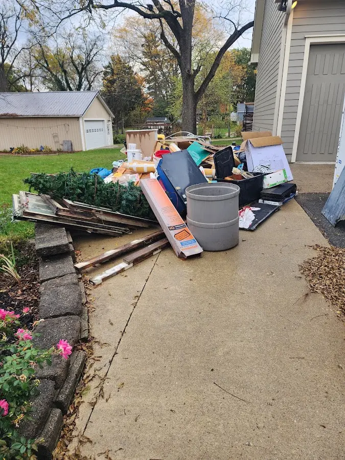 Dumpster being loaded with debris for Commercial Dumpster Rental in Boynton Beach